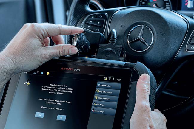 Automotive key programming equipment at a vehicle